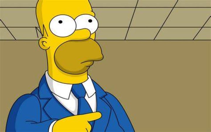 Homer Simpson is pointing his finger at a sumo wrestler. 